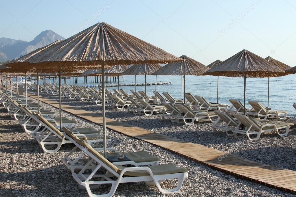 depositphotos 119938598 stock photo sunbeds at the sea - Lidi Balneari SUP Attrezzatura Sport Mare - Stabilimenti Mare Lago Mondo Balneare